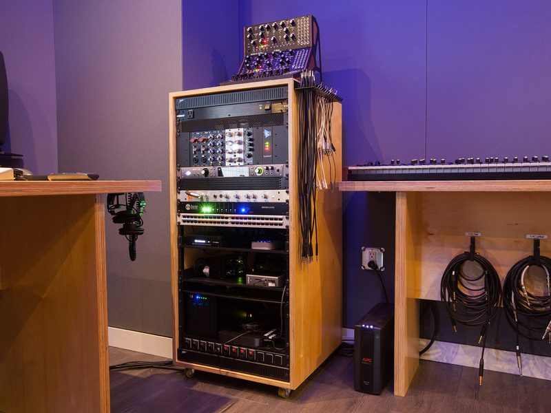 Equipment rack with patchbays, interfaces and cable storage