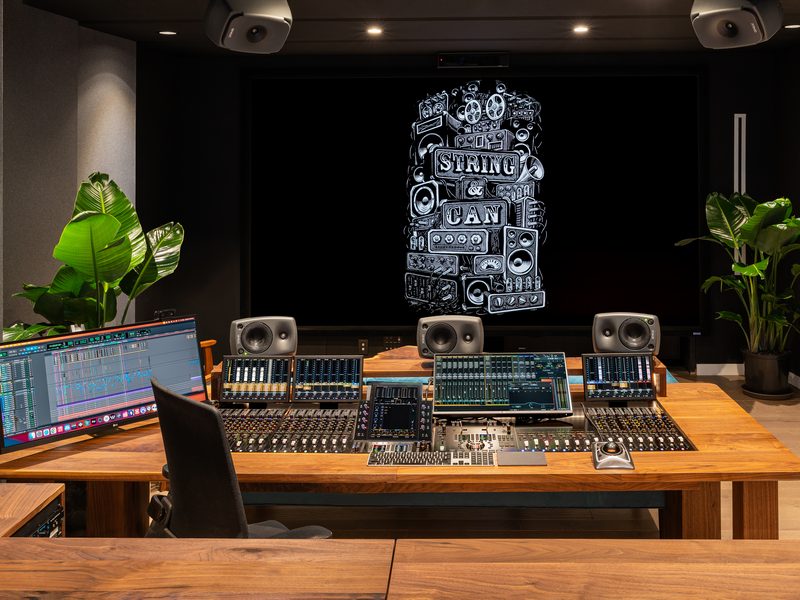 Mix position facing the screen, flanked by main monitors
