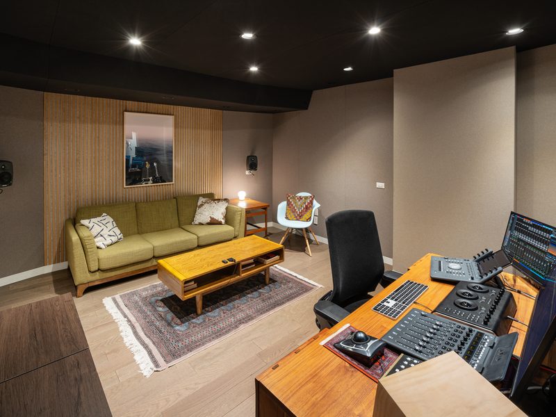 Second suite with lounge seating and an editing desk