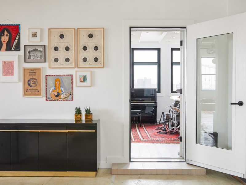 Entry gallery wall with the live room beyond